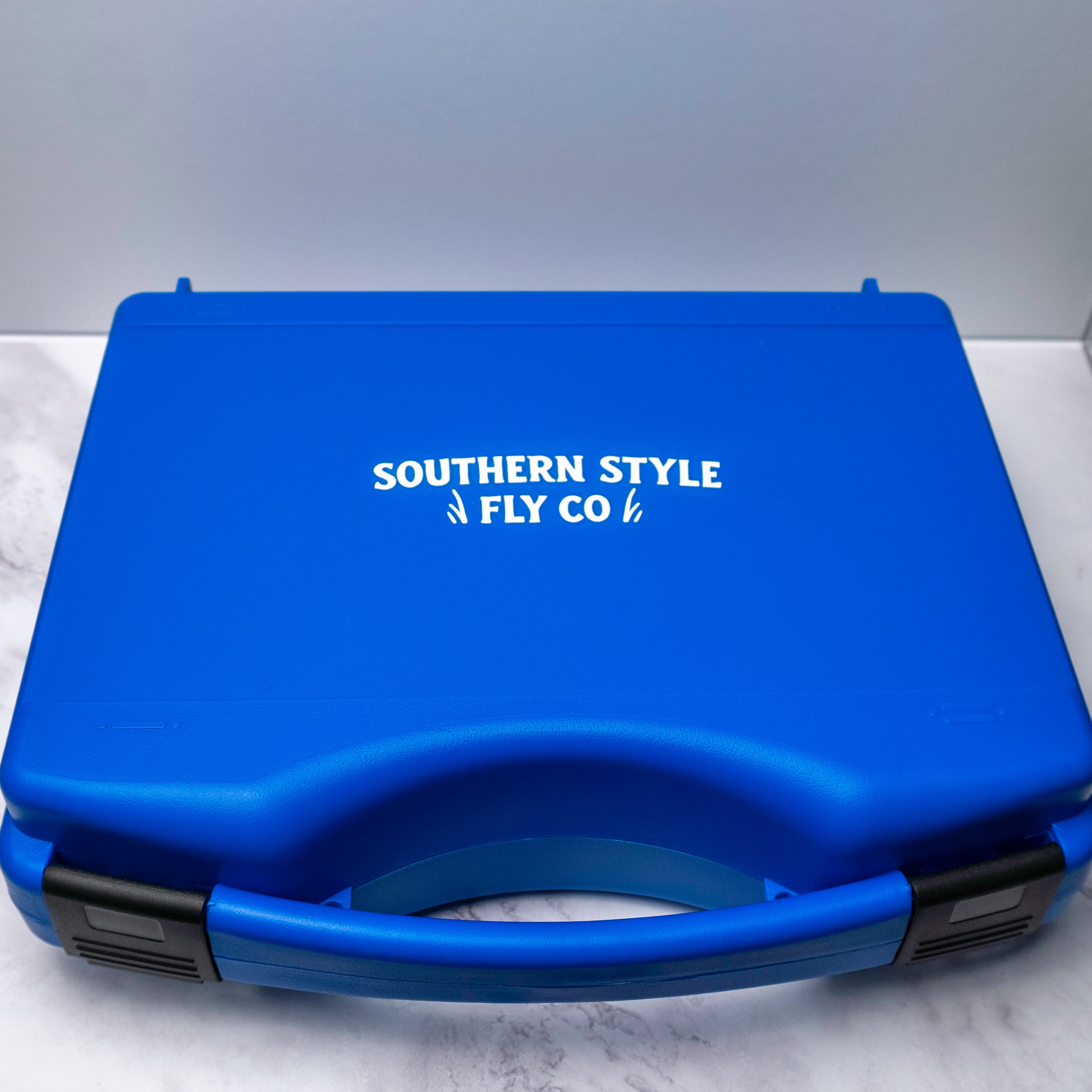Large blue Southern Style Fly Co Salt 10WT fly box with dual snap latches and deep foam storage designed to hold over 200 large saltwater flies.
