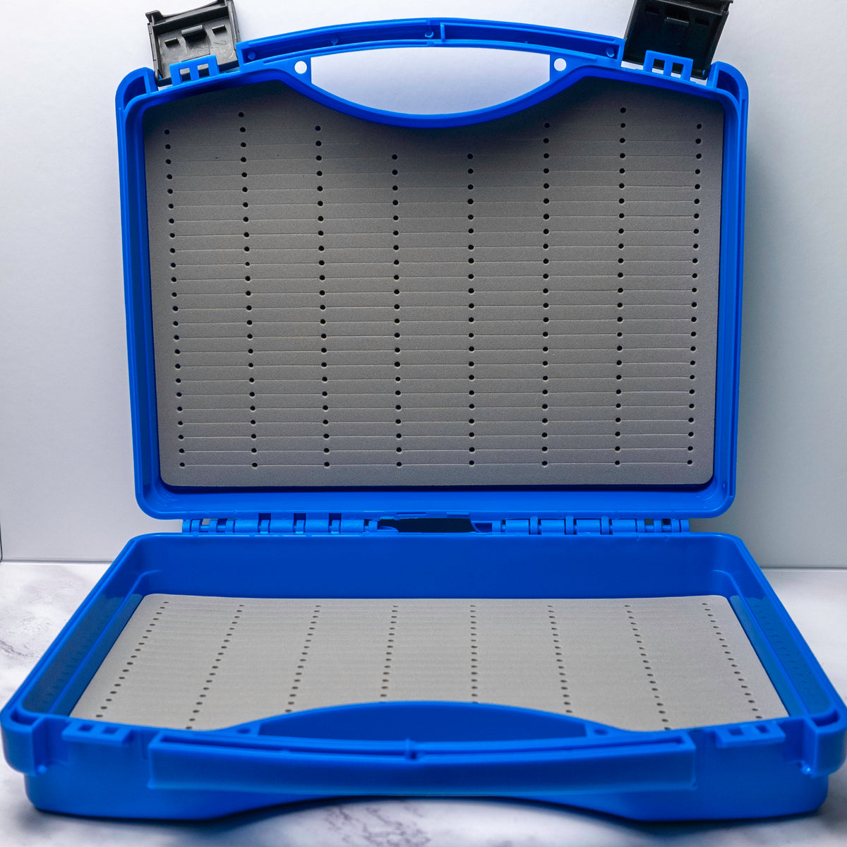 Large blue Southern Style Fly Co Salt 10WT fly box with dual snap latches and deep foam storage designed to hold over 200 large saltwater flies.