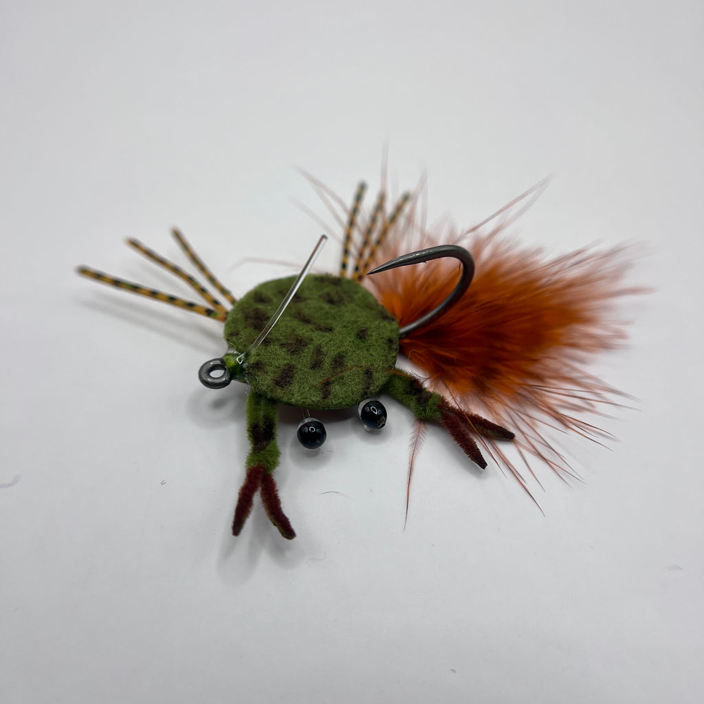 Dime Piece Crab fly tied with barred marabou tail, sili legs, epoxy-coated felt shell, and centered micro lead weight on a Size 2 Mustad hook.