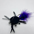 Dime Piece Crab fly tied with barred marabou tail, sili legs, epoxy-coated felt shell, and centered micro lead weight on a Size 2 Mustad hook.