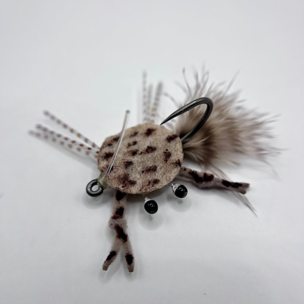 Dime Piece Crab fly tied with barred marabou tail, sili legs, epoxy-coated felt shell, and centered micro lead weight on a Size 2 Mustad hook.