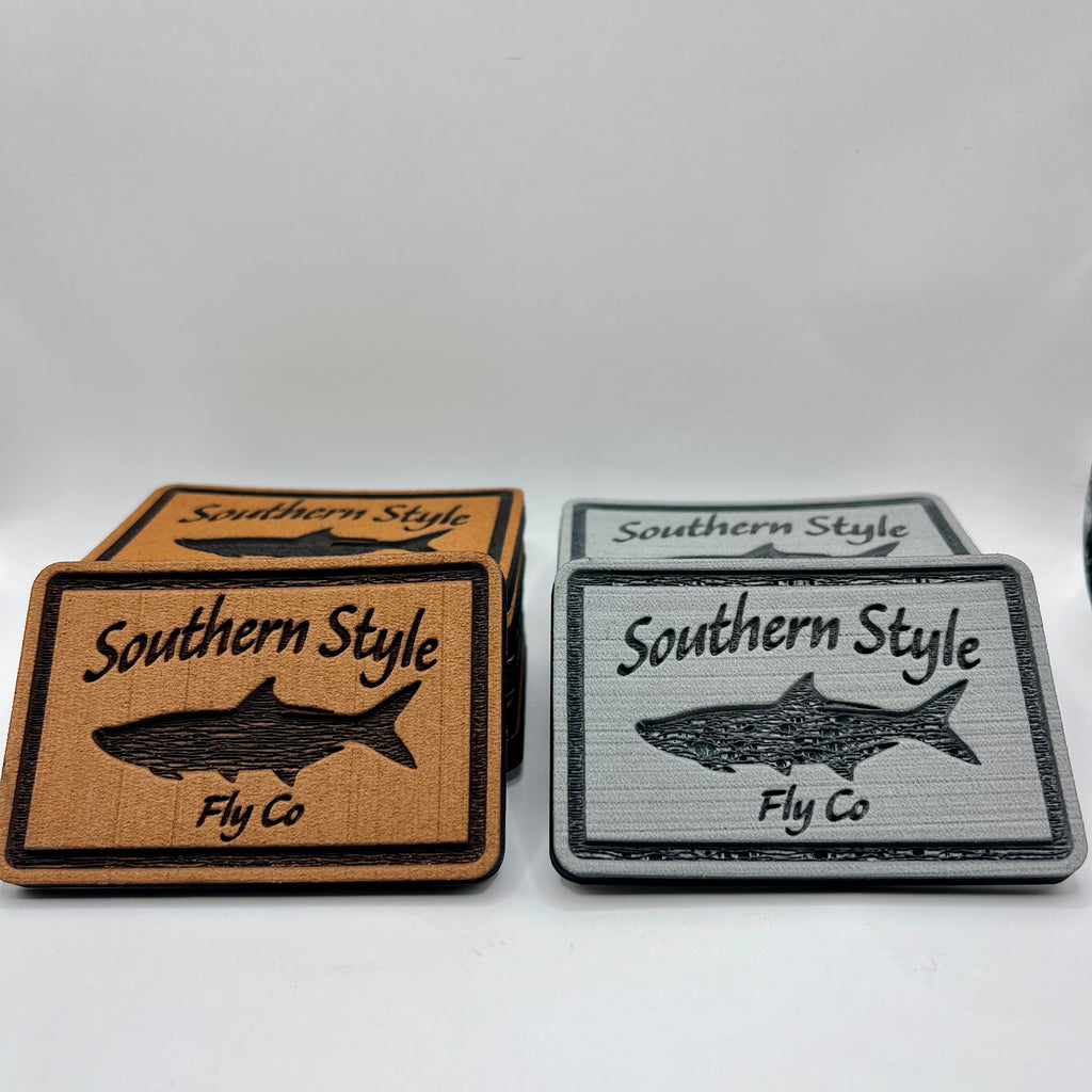Southern Style Fly Co. 2x3 peel-and-stick foam fly pads in tan and grey featuring the classic tarpon logo, designed to mount on fly boxes, coolers, or boat consoles.