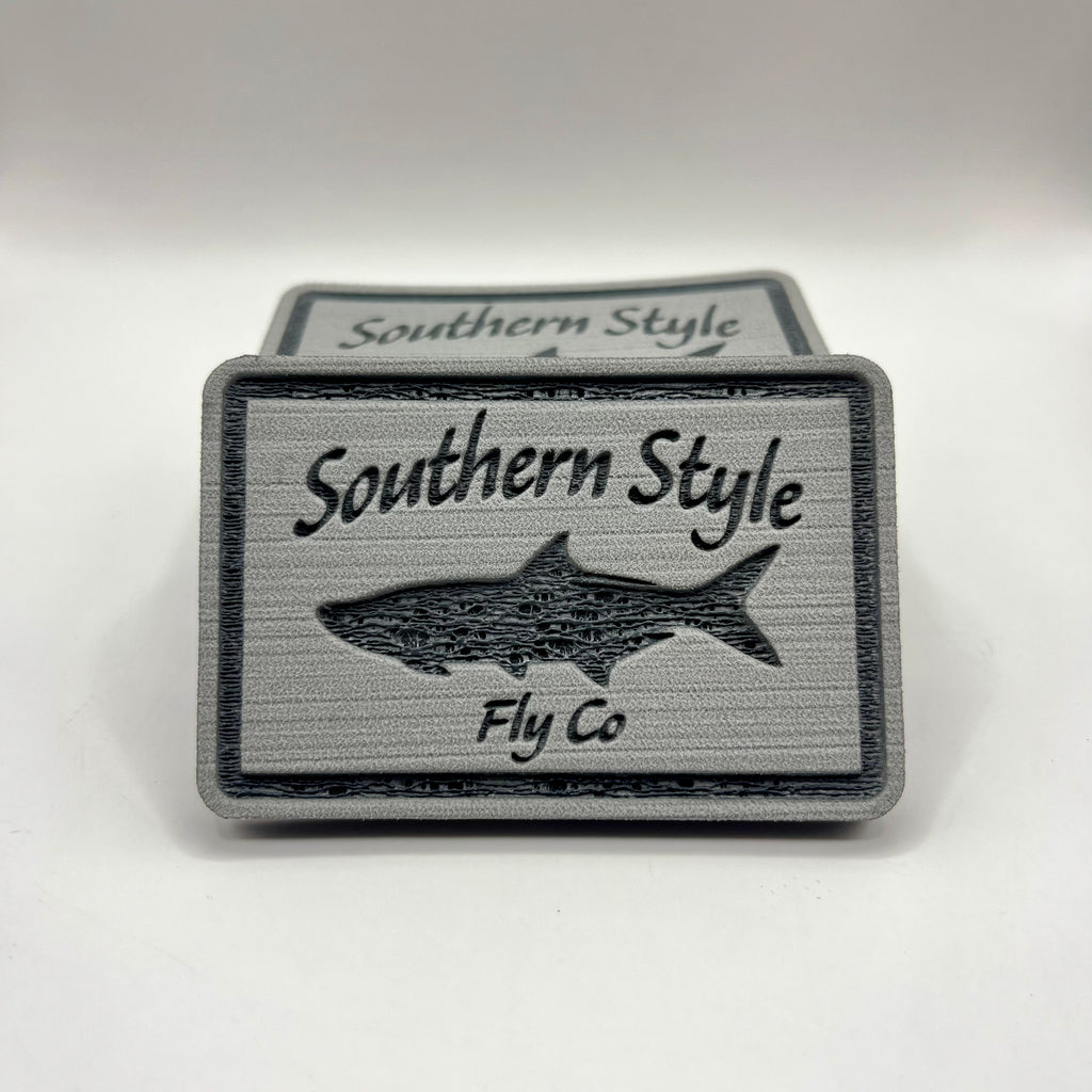 Tan 2x3 peel-and-stick foam fly pad with Southern Style Fly Co. tarpon logo, designed for mounting on fly boxes, coolers, or boat consoles.