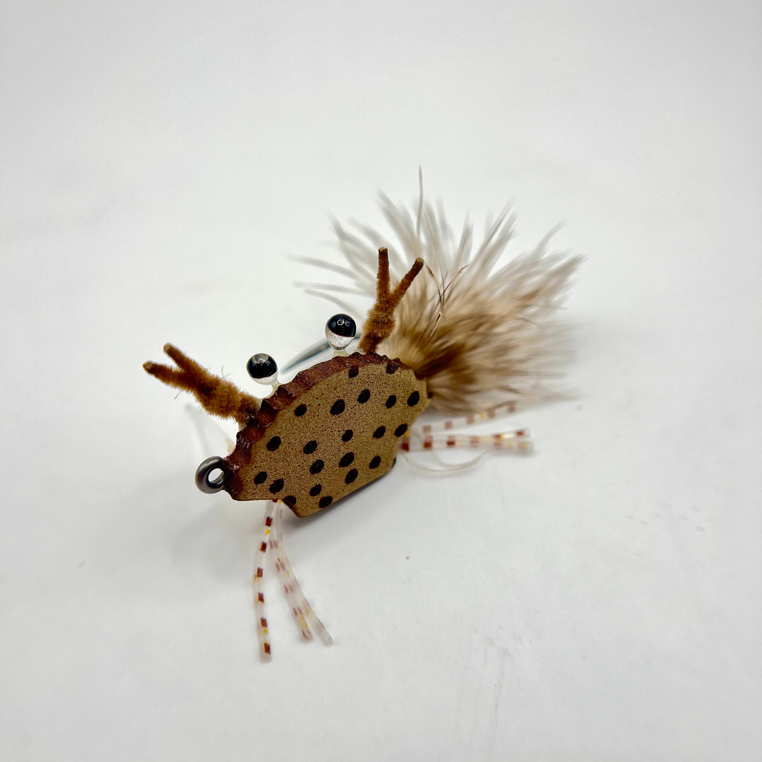 Top profile of buoyant crab fly for redfish with realistic legs and compact body