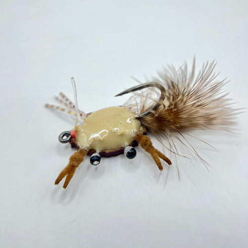 Bottom profile of redfish crab fly displaying epoxy body, marabou tail, and weed guard