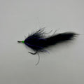 Full profile view of Tarpon Cigar fly in purple and black, slim pattern designed for laid-up and cruising tarpon