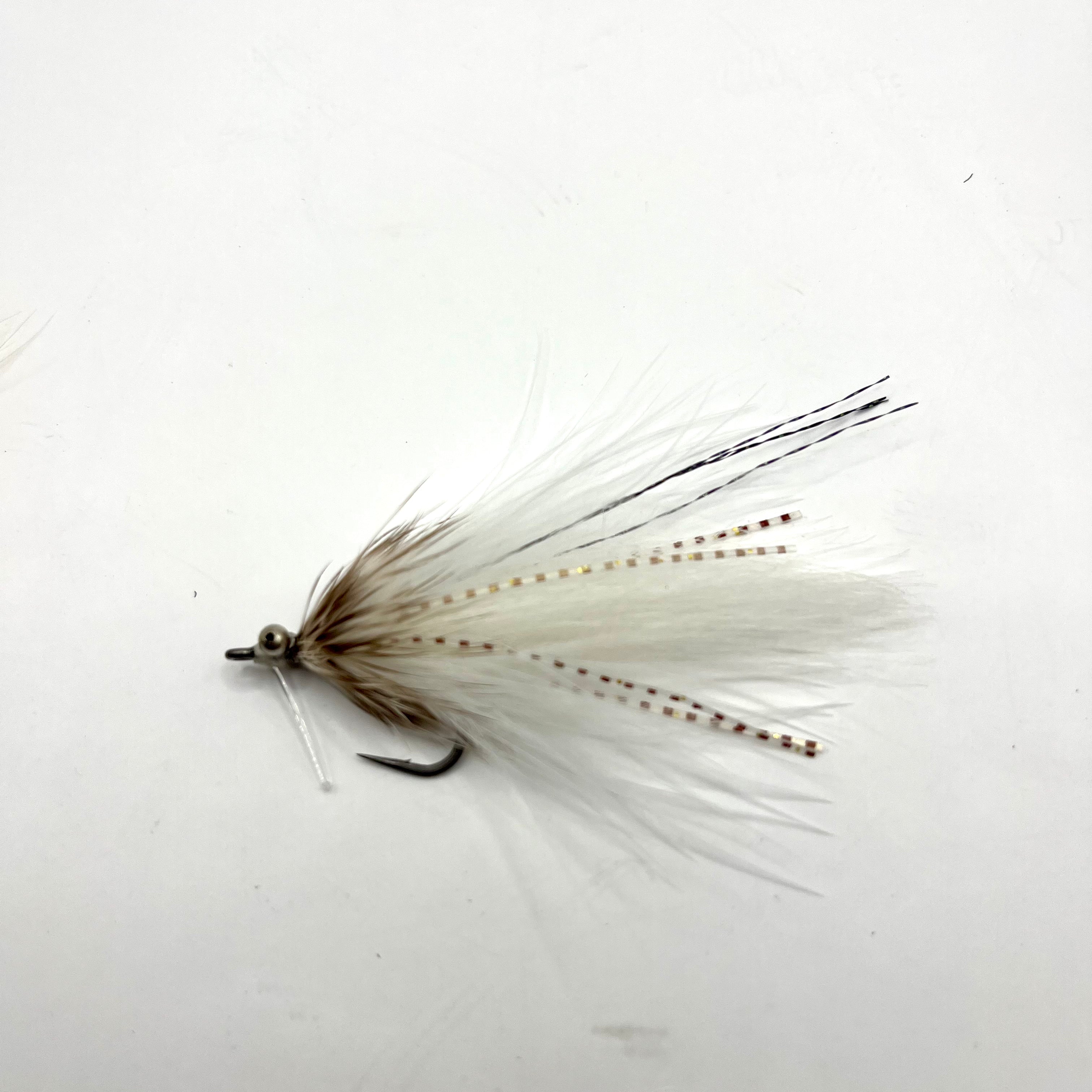Side profile of the white Stalker Shrimp fly showing balanced proportions, weed guard placement, and streamlined shrimp silhouette for mangroves and flats.