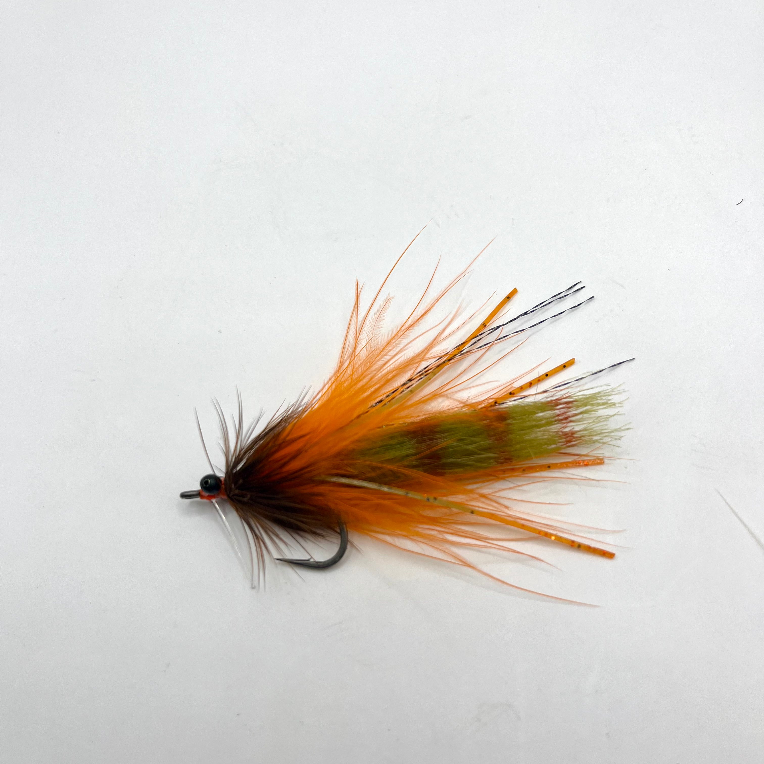 Side profile of the orange-brown Stalker Shrimp fly featuring realistic shape, movement-oriented materials, and shallow-water shrimp imitation design.