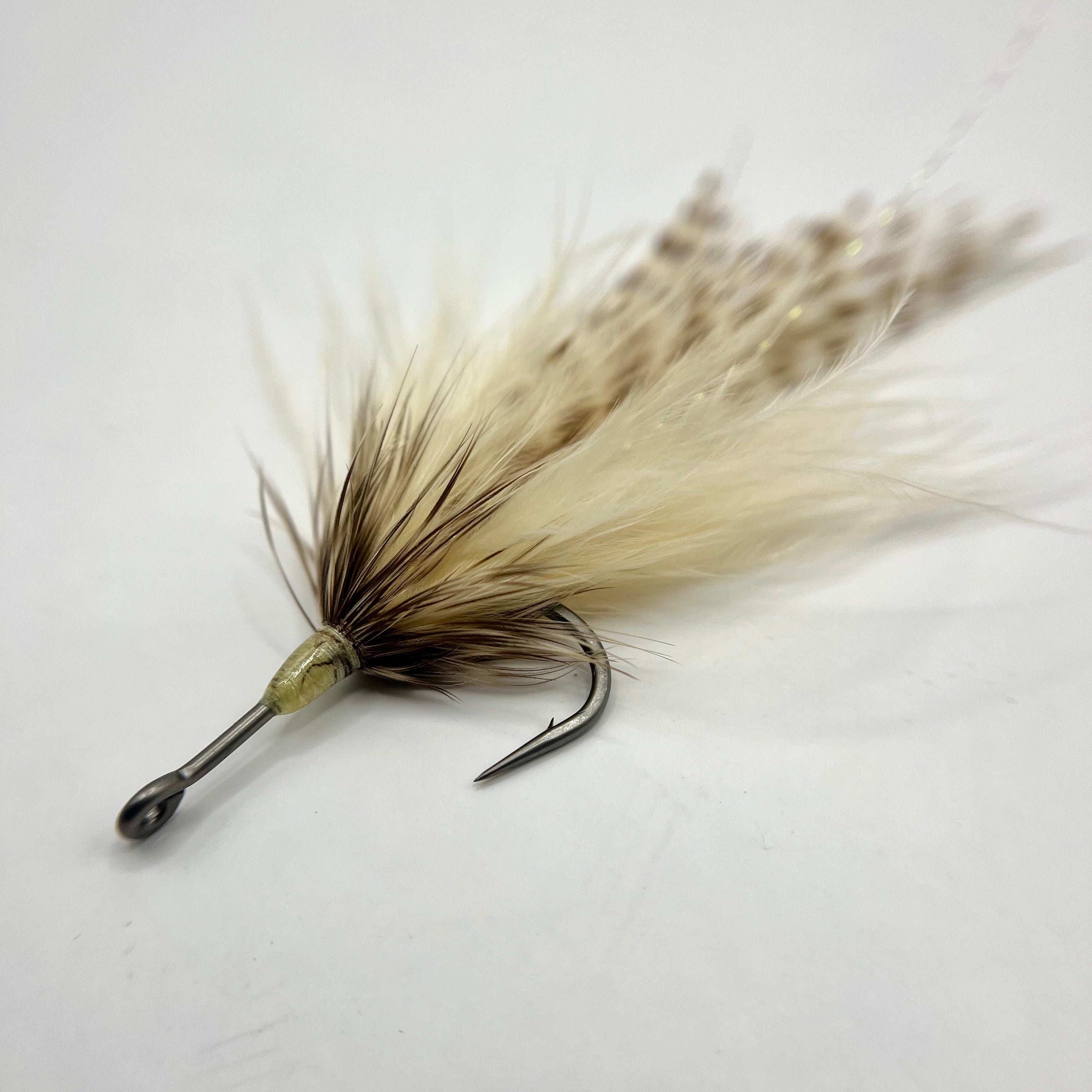 Close-up macro of the Southern Roach tarpon fly showing flowing materials, classic baitfish profile, and high-movement design tied on a 1/0 streamer hook.