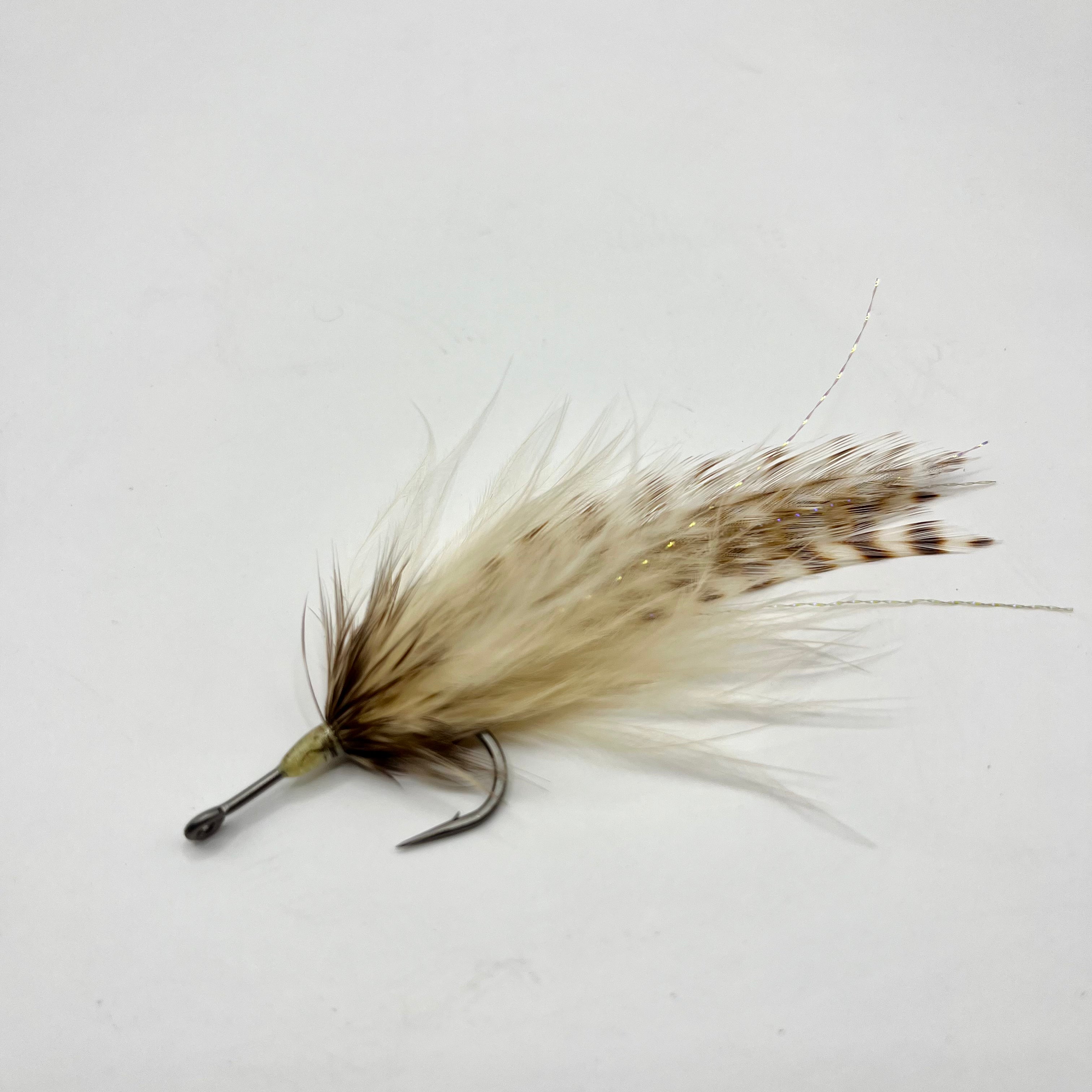 Side profile of the Southern Roach tarpon fly displaying its elongated silhouette, balanced proportions, and movement-focused build for migrating tarpon.