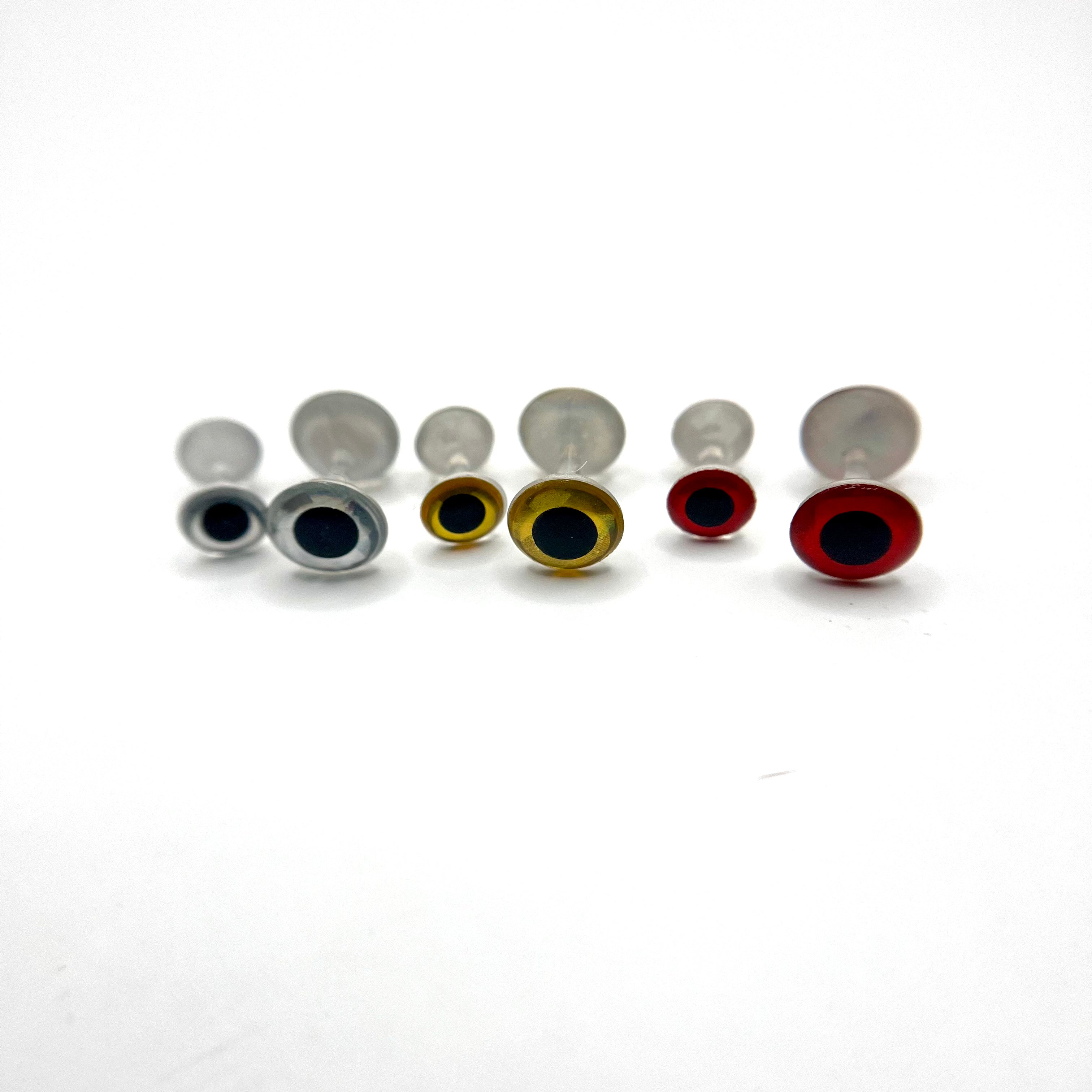 Weightless 3D dumbbell eyes in silver, gold, and red color variations displayed together, showing 3D depth and clean dome finish.