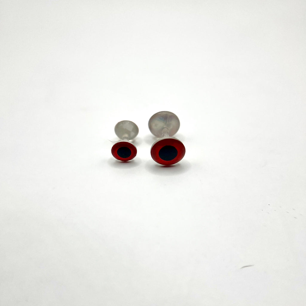 Weightless 3D dumbbell eyes in red finish featuring realistic 3D depth, built for aggressive trigger presentations in saltwater flies.