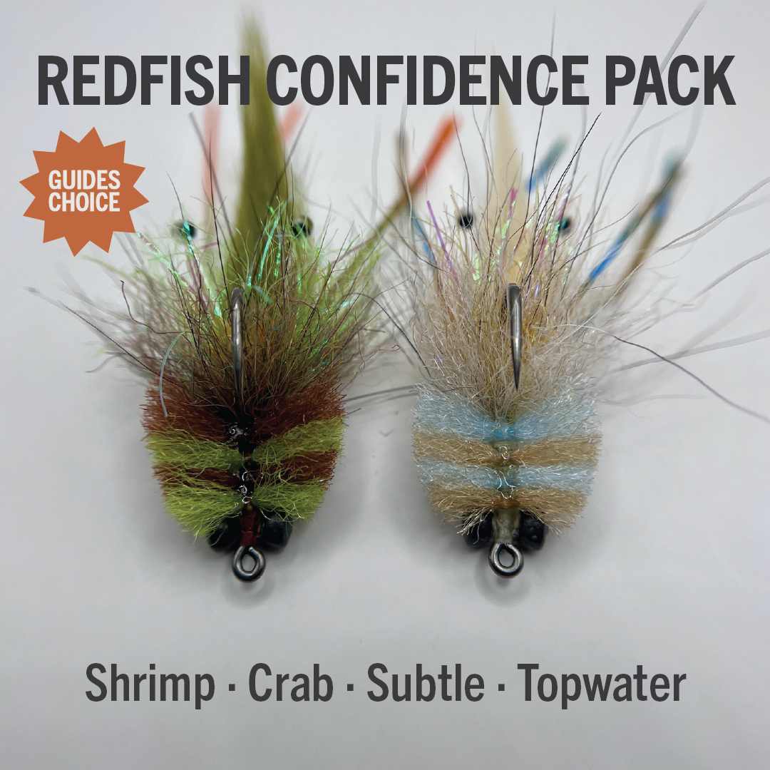 Two realistic shrimp and crab style saltwater flies side by side with weed guards and textured bodies, labeled Redfish Confidence Pack with Guides Choice badge and text Shrimp Crab Subtle Topwater.
